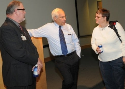Donald Berwick M D and Professors Kevin Ryan and Holly Felix talking after forum discussion